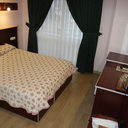 Metropolis Hotel Torbali Bagian luar foto