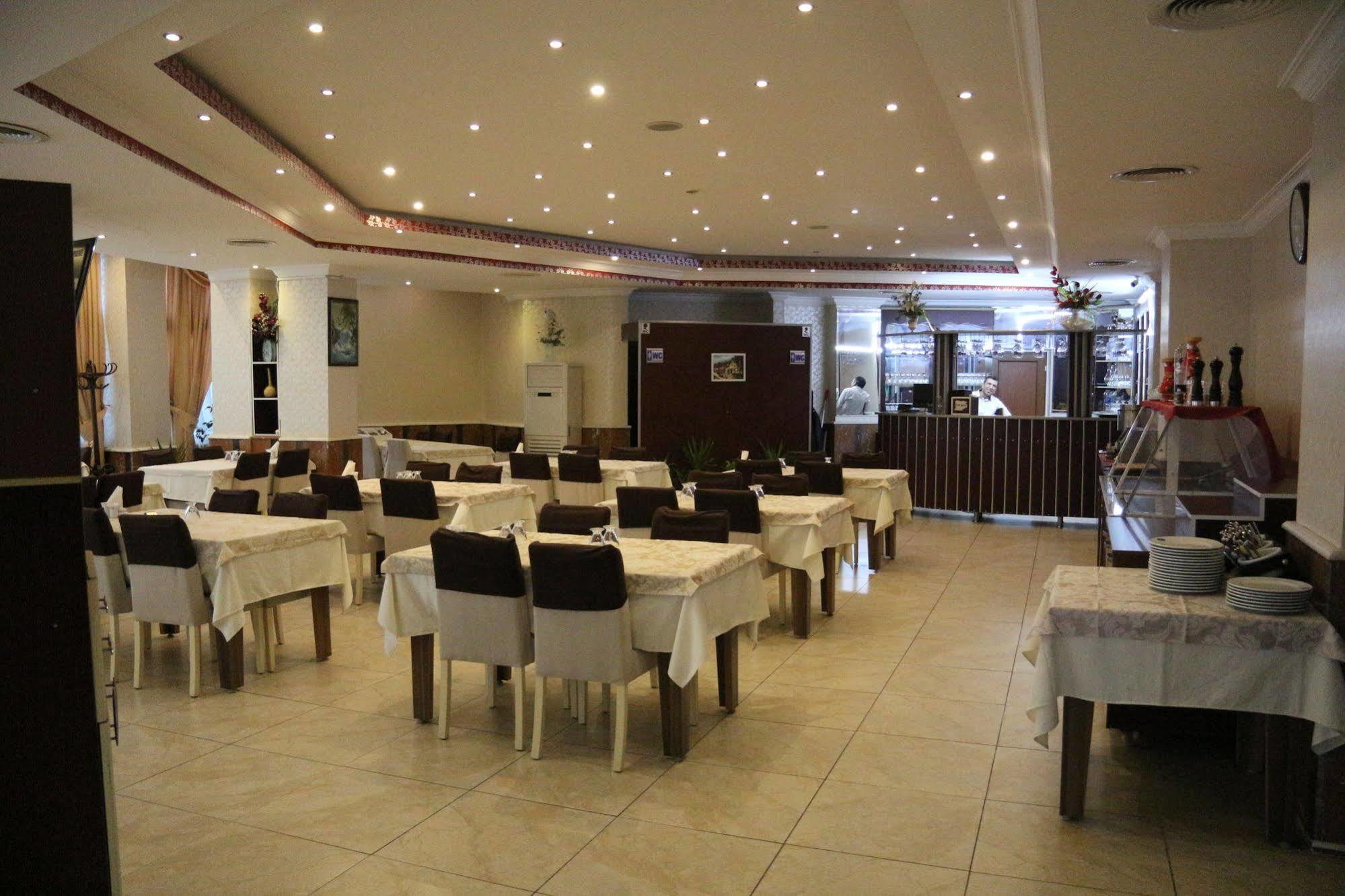 Metropolis Hotel Torbali Bagian luar foto