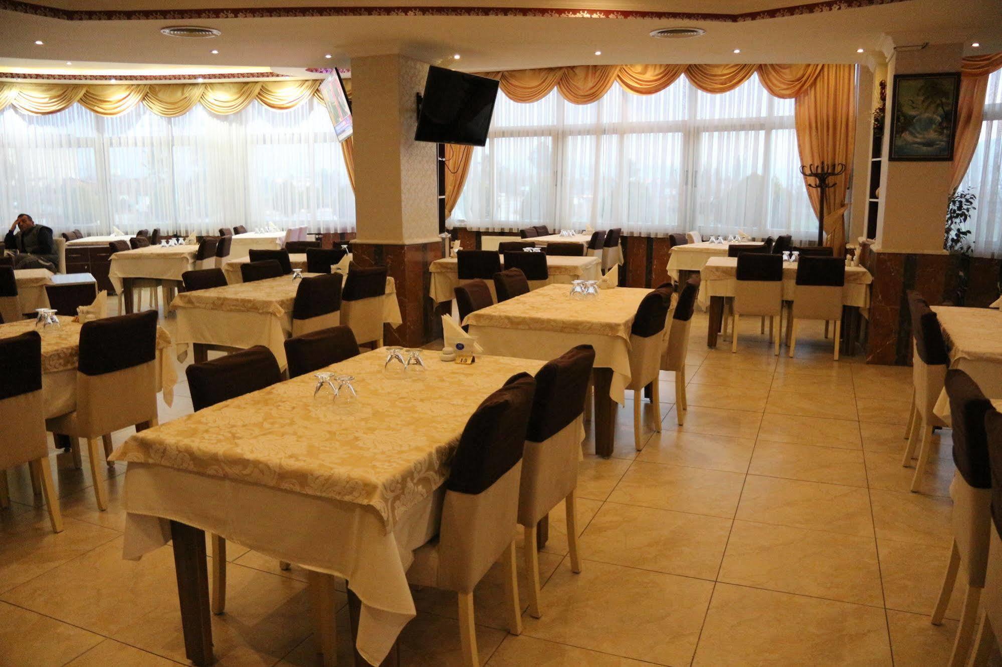 Metropolis Hotel Torbali Bagian luar foto